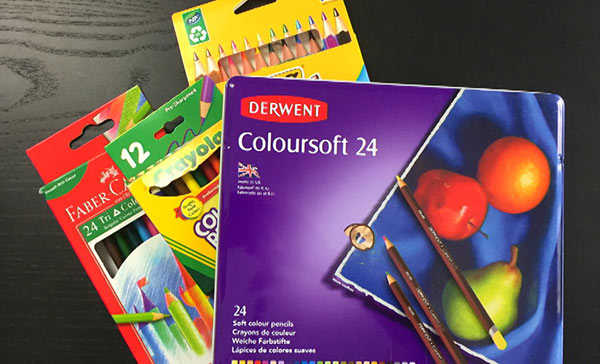 Assorted coloured pencil brands in boxes