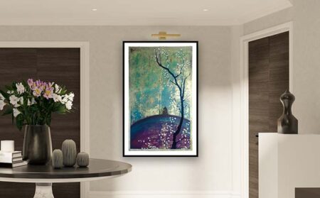 Painting of a tree with blossom on a hill on a gallery wall