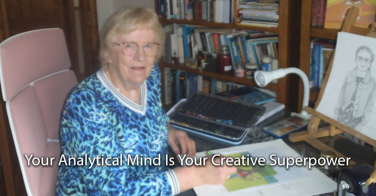 Artist Mary Egan sits at her art table drawing