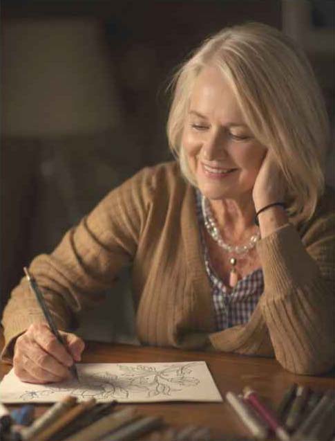 Woman peacefully drawing in Studio